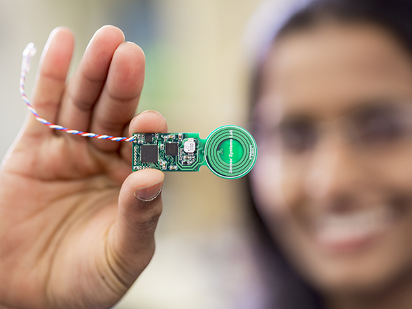 group-lab-sensor-systems-lab A person holds up a miniature sensor